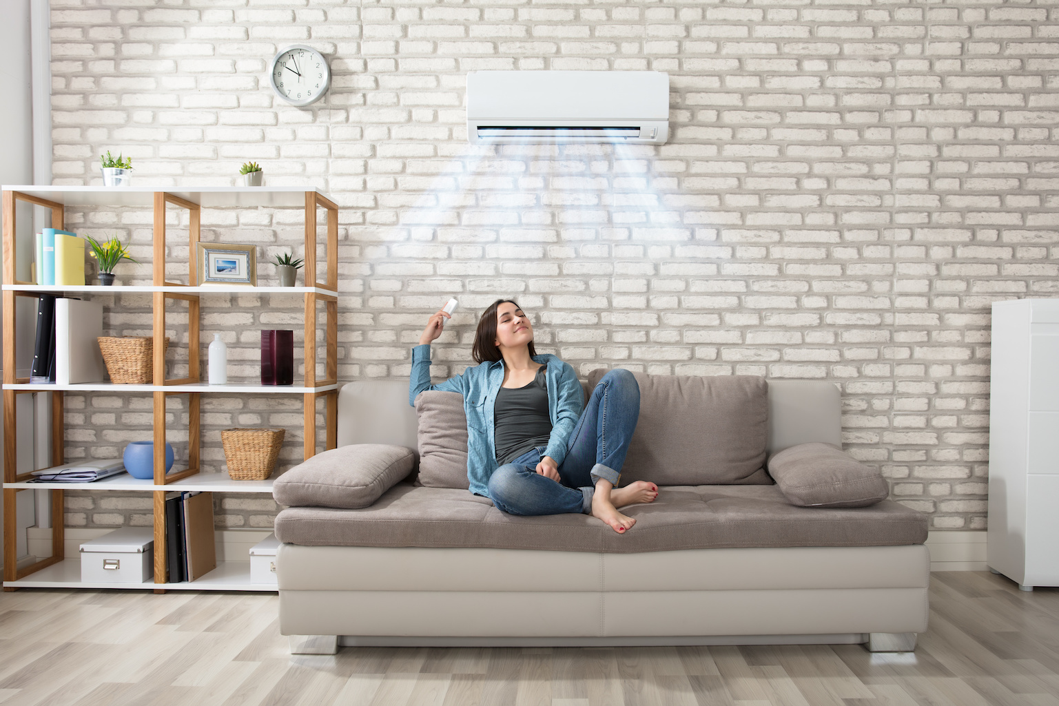 woman-relaxing-under-the-air-conditioner