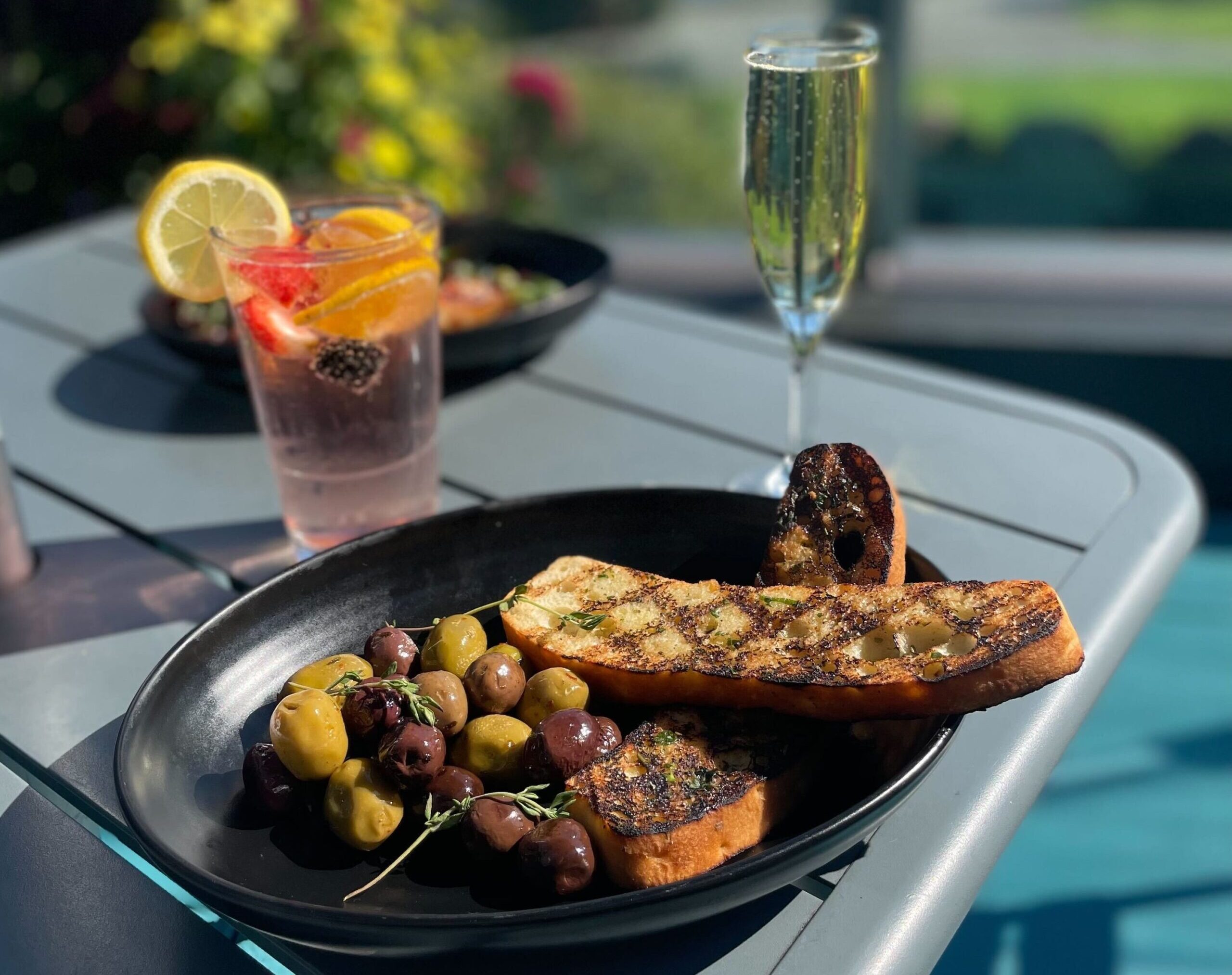 happy-hour-warm-olives-sourdough-bread-scaled-e1722462235317
